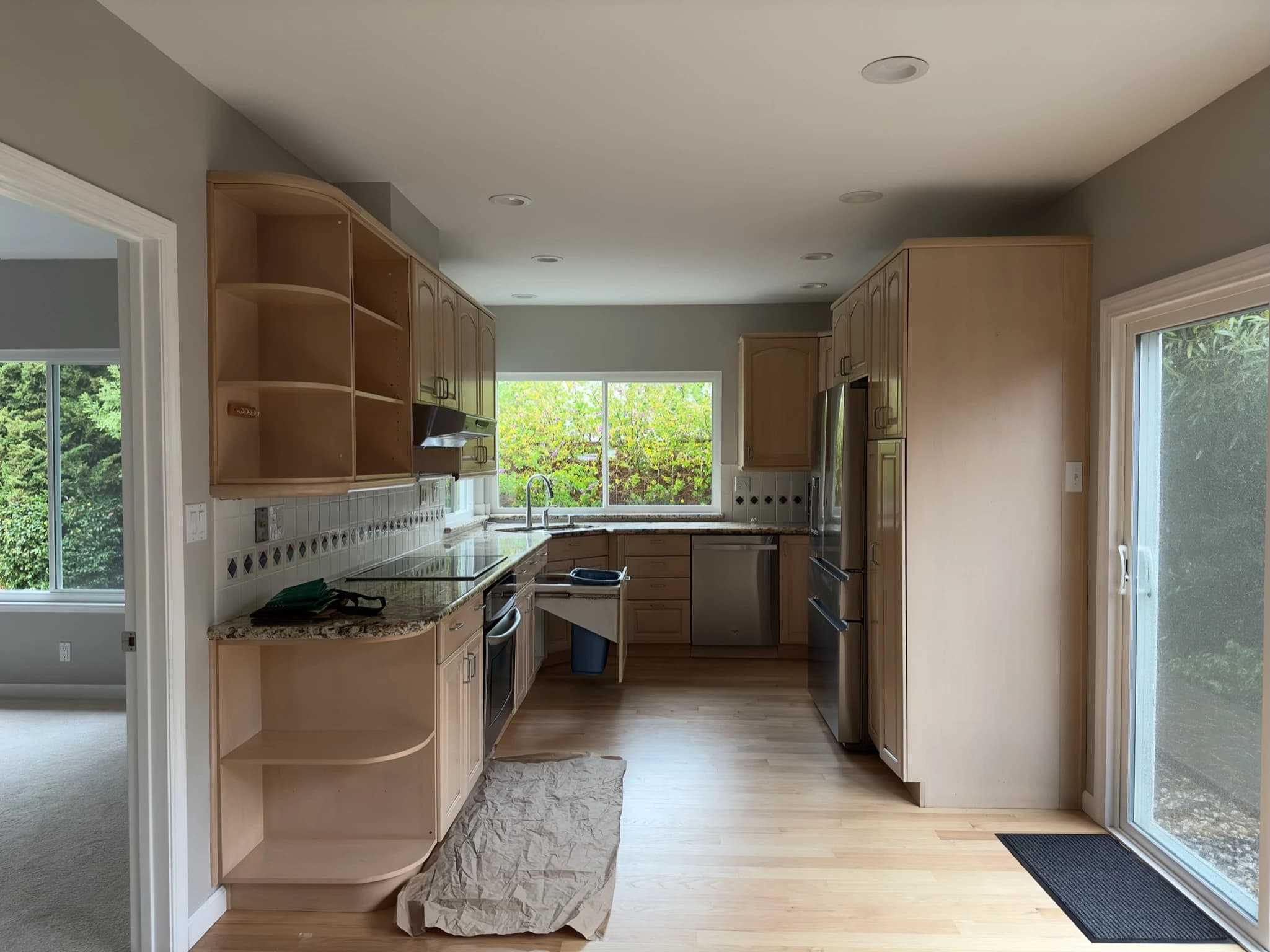 Foster City kitchen before remodeling with dark built-in cabinetry and a closed layout